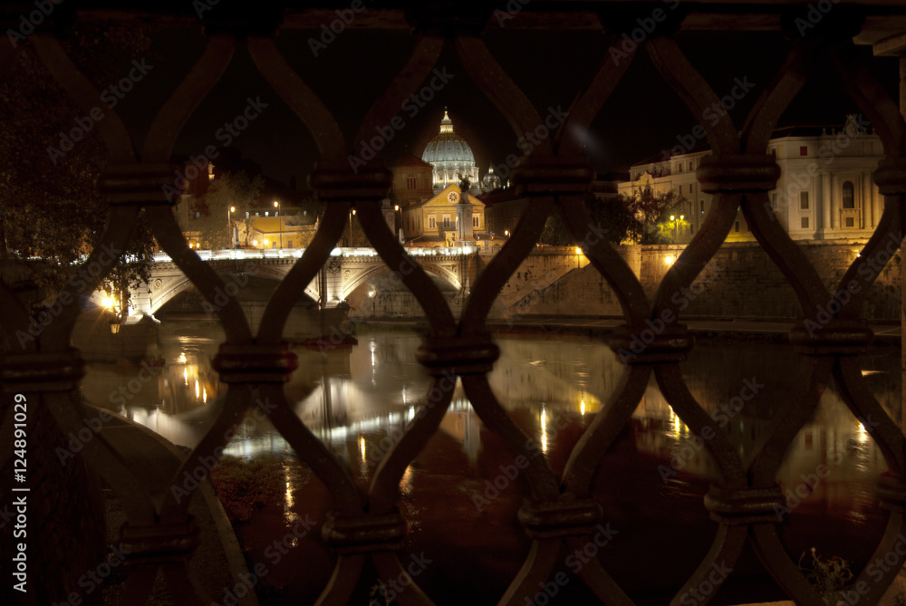 tiber river by night in Rome with the reflection of the city