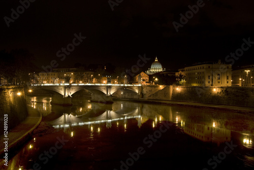 tiber river by night in Rome with the reflection of the city