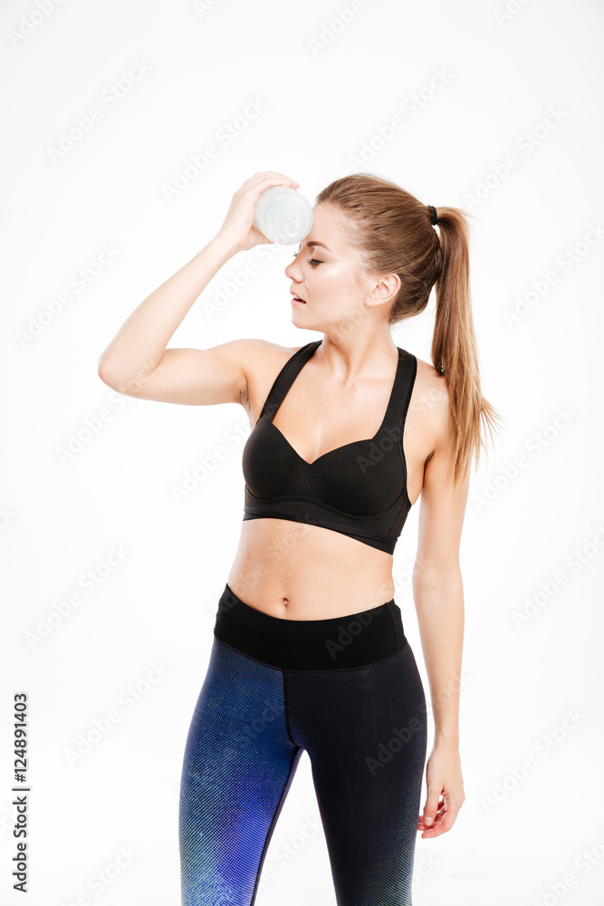 Portrait of a tired cute woman standing with sports bag Portrait of a tired cute woman standing with sports bag
