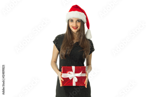 Girl in santa hat smiling and looking at the camera