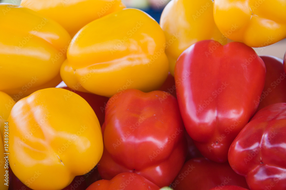 yellow and red bell peppers on the counter a market as background yellow and red bell peppers on the counter a market as background