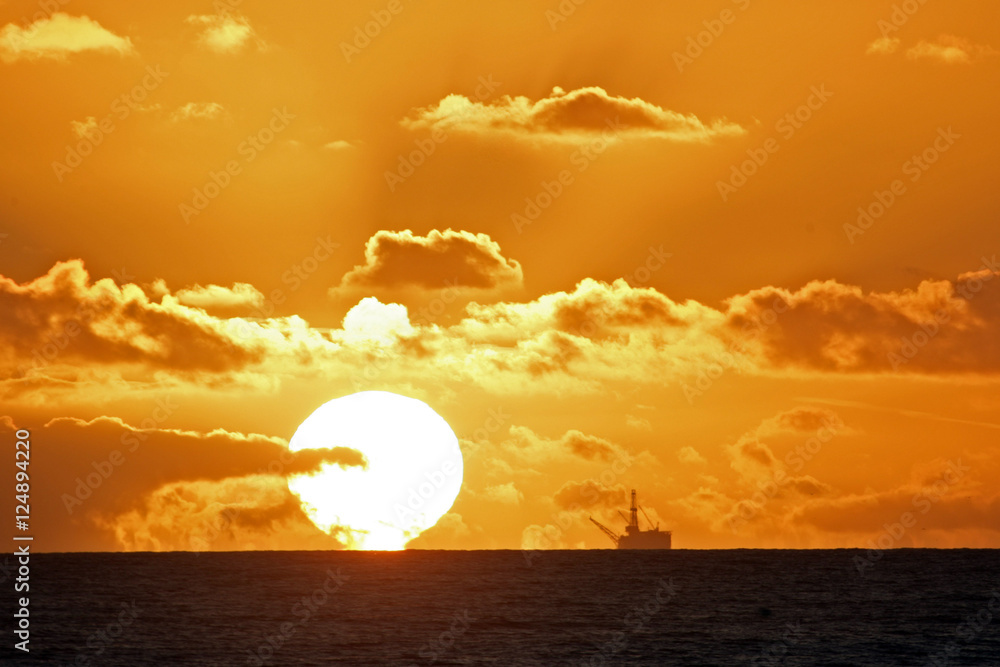 oil rig n ocean sunset