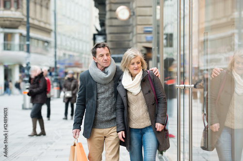 Senior couple window shopping in city centre. Winter © Halfpoint