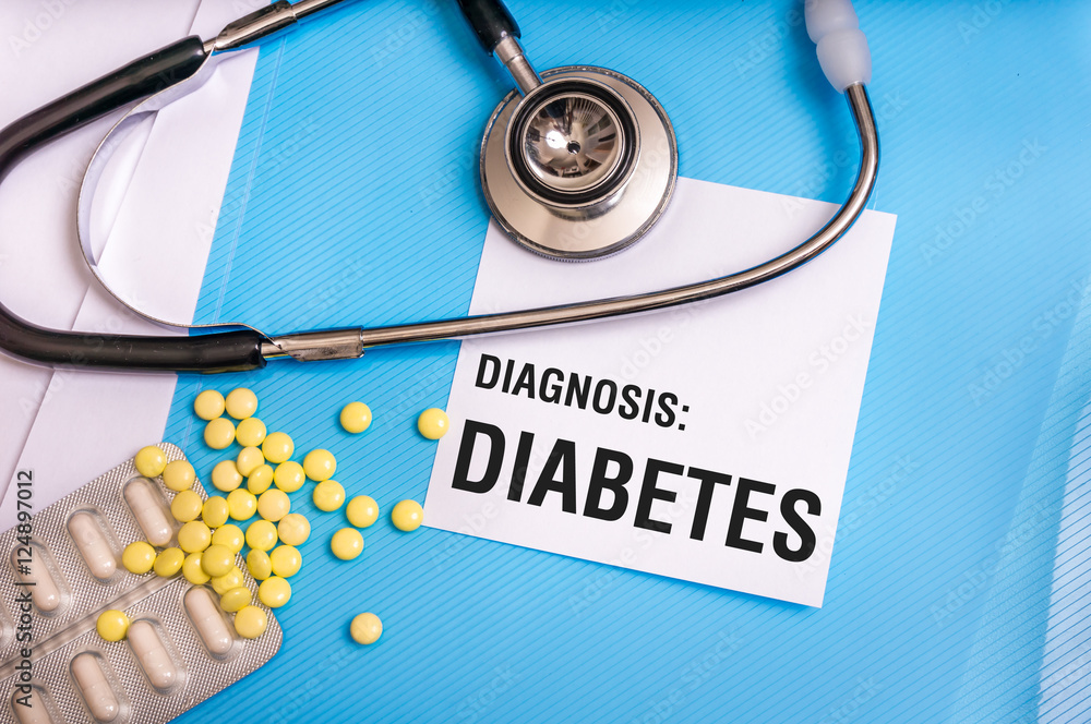 Diabetes word written on medical blue folder with patient files Diabetes word written on medical blue folder with patient files