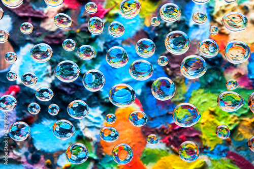 Water drops on colorful painting palettes background