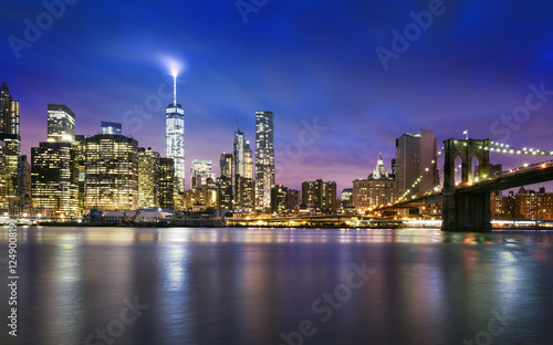 New York City - beautiful sunset over manhattan with manhattan and brooklyn bridge