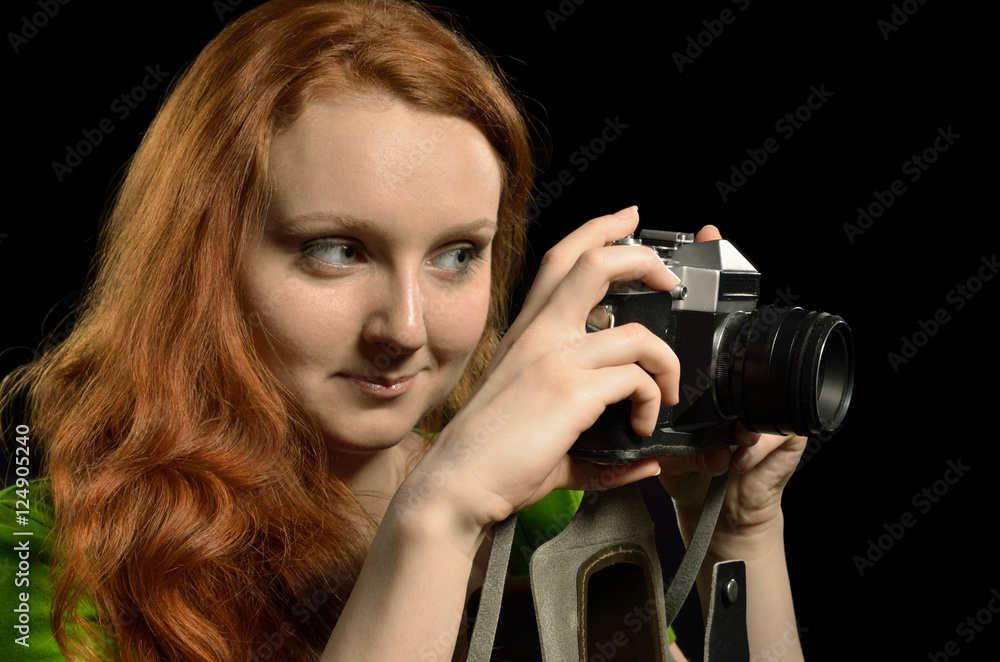 Pretty woman with an old film photocamera Pretty woman with an old film photocamera