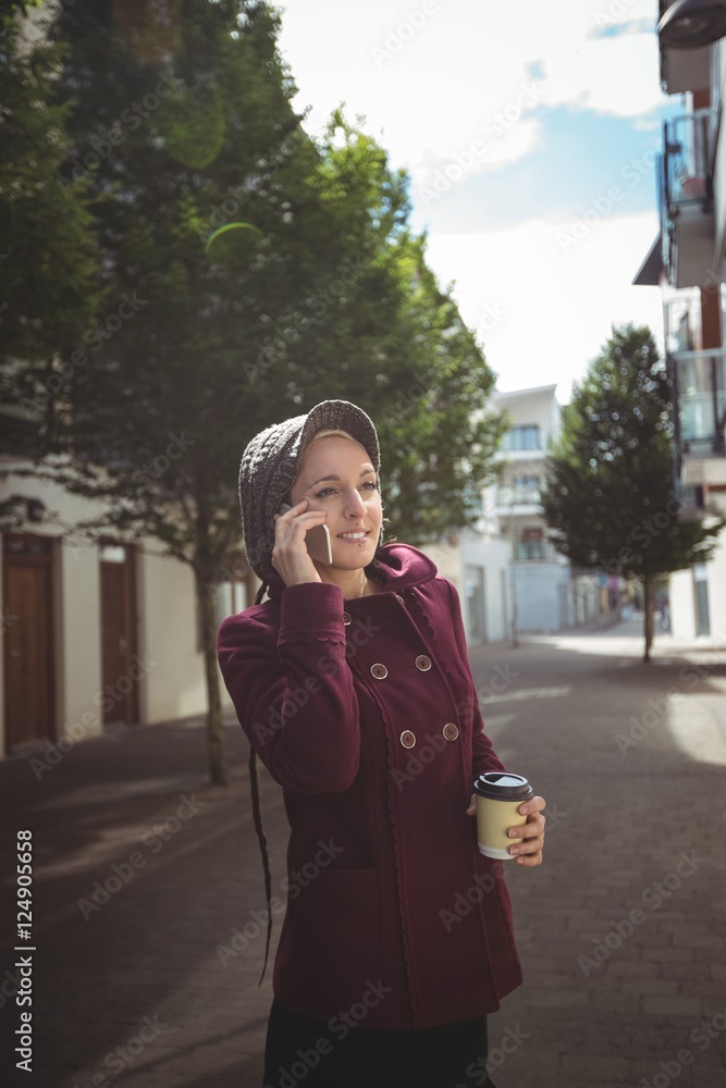 Fototapeta premium Woman talking on mobile phone