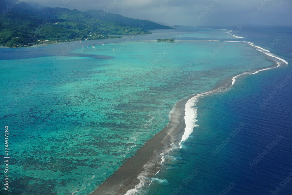 Aerial view of tropical lagoon and coral barrier reef of Raiatea island, south Pacific ocean, Society islands, French Polynesia
