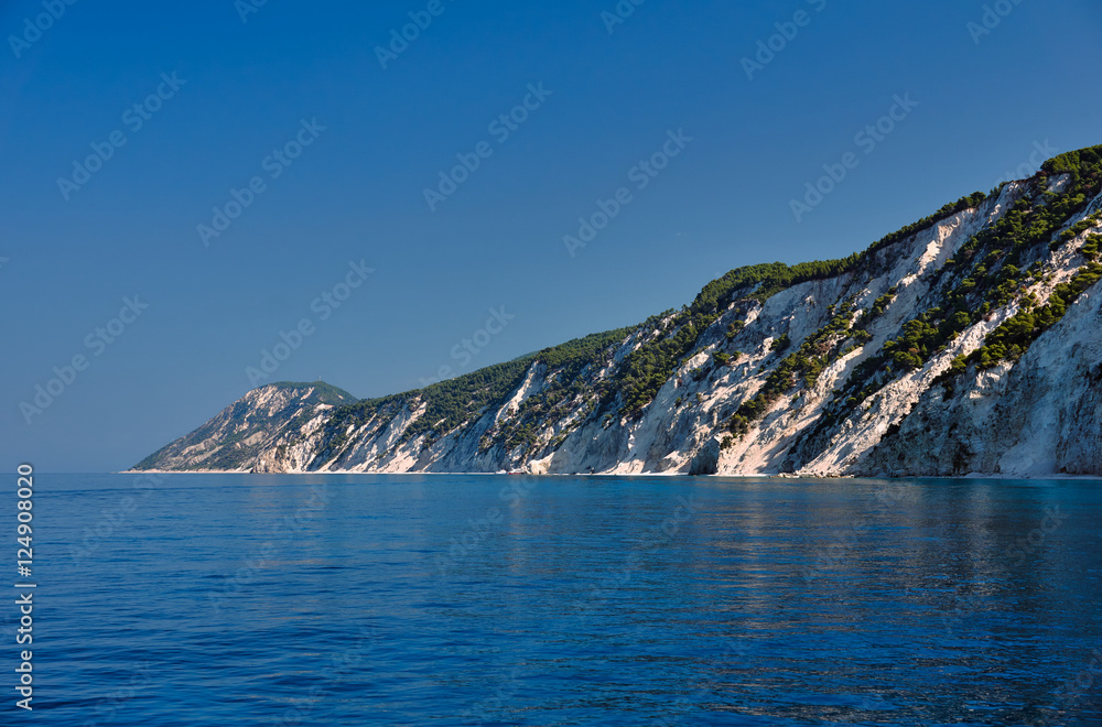 Beach and rocky cliff on the Greek island of Lefkada.