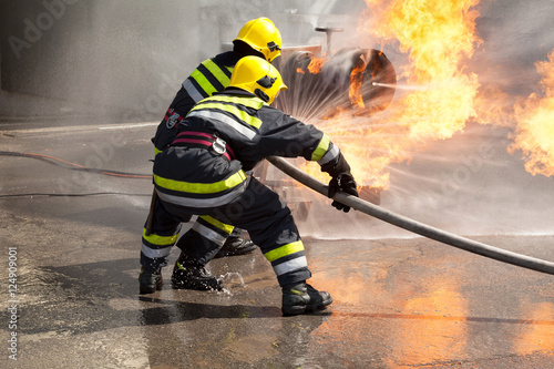 Firefighters in action. Fire department training.