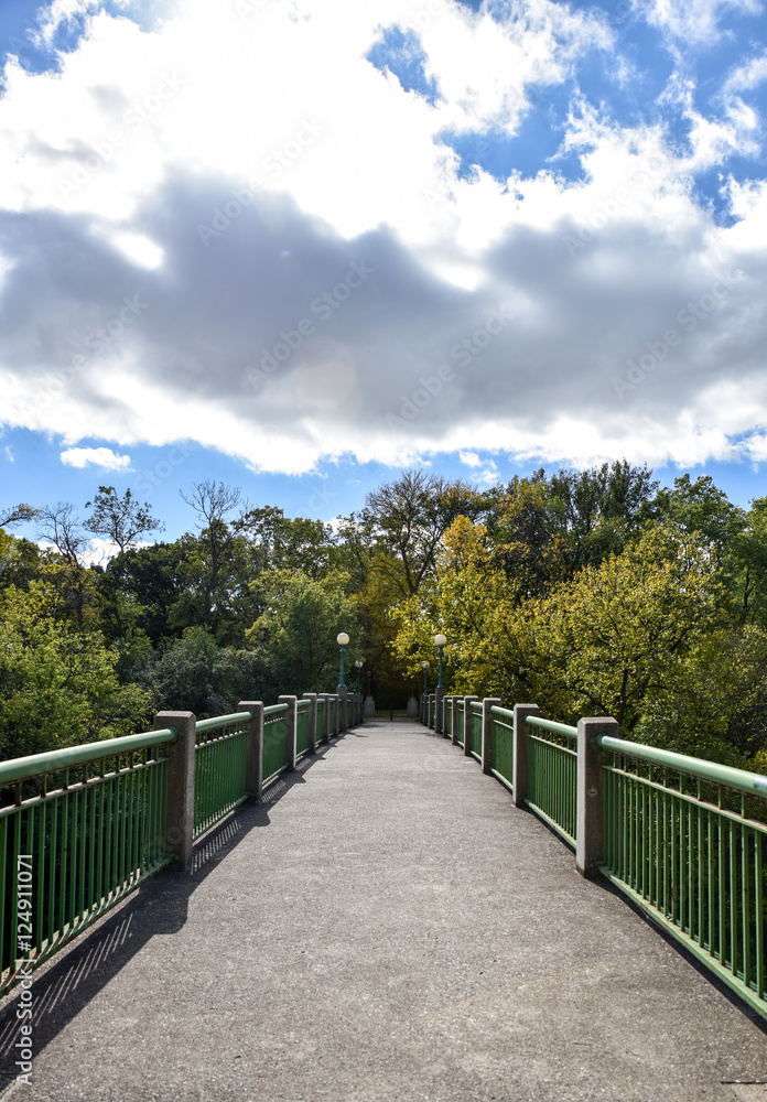 Walking bridge across roadway on sunny day