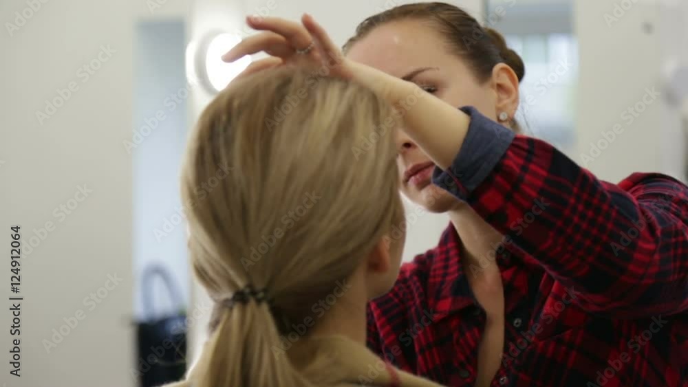Make-up artist doing make-up. Make-up artist doing make-up.