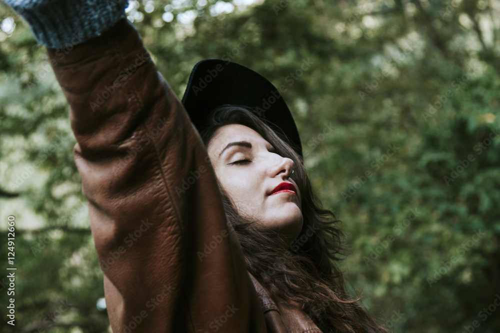 young woman enjoying autumn in the woods young woman enjoying autumn in the woods