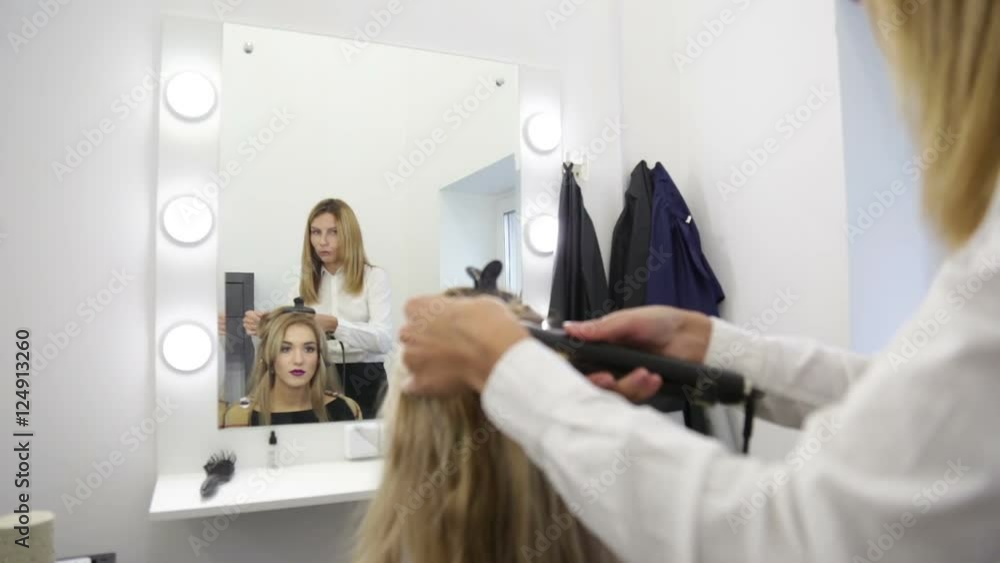 Girl hairdresser doing hairstyle. Girl hairdresser doing hairstyle.