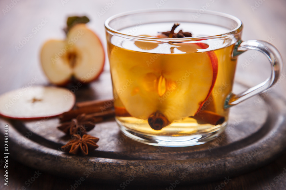 Apple Cider Drink,Juice,Cider with Spices ,Cinnamon sticks and fresh Apples.Hot drink for Autumn and Winter Christmas evenings.selective focus. Apple Cider Drink,Juice,Cider with Spices ,Cinnamon sticks and fresh Apples.Hot drink for Autumn and Winter Christmas evenings.selective focus.