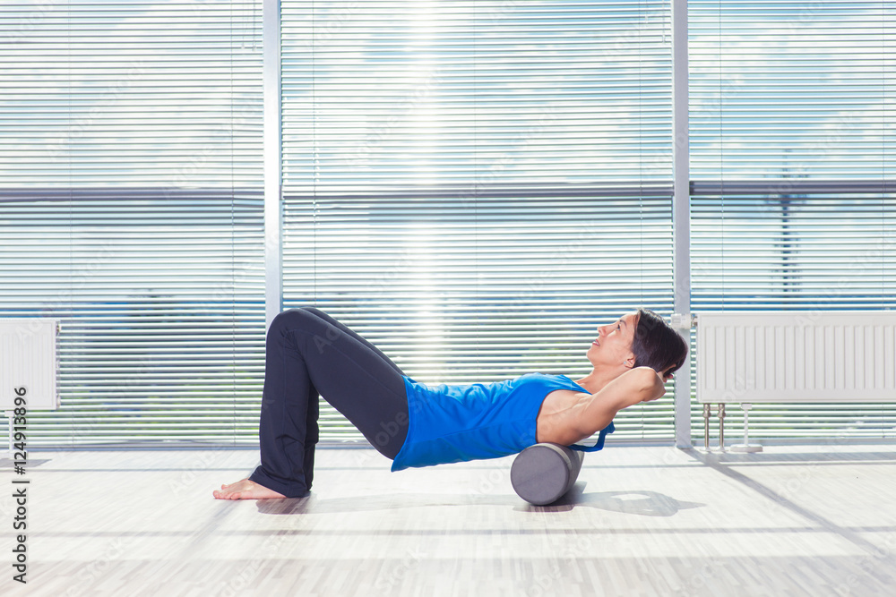 fitness, sport, training and lifestyle concept - woman doing pil fitness, sport, training and lifestyle concept - woman doing pil