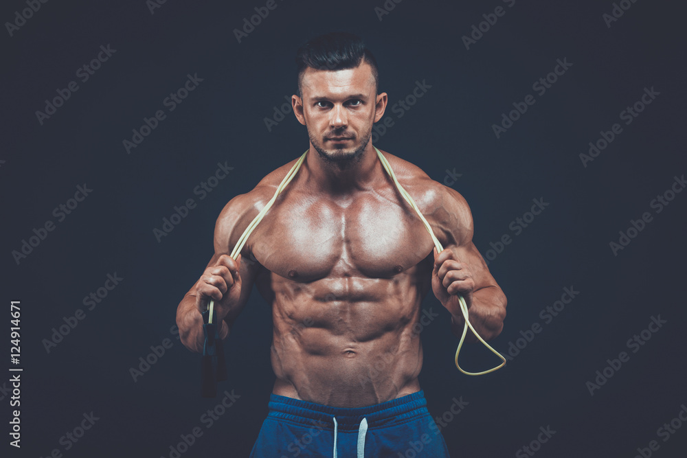 Muscular man skipping rope. active  sport  fitness 