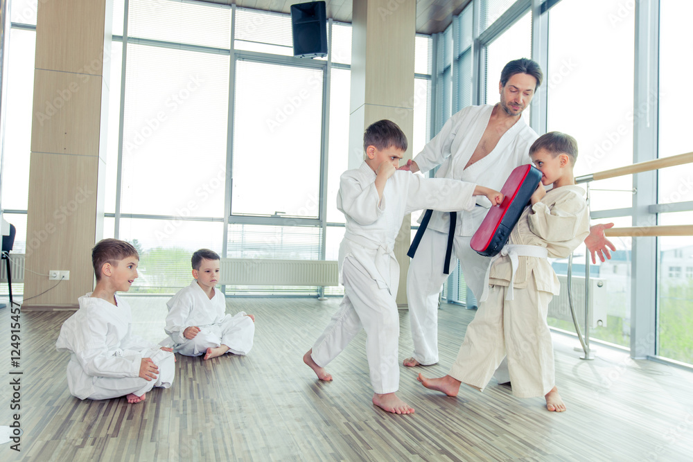 young, beautiful, successful multi ethical kids in karate positi young, beautiful, successful multi ethical kids in karate positi