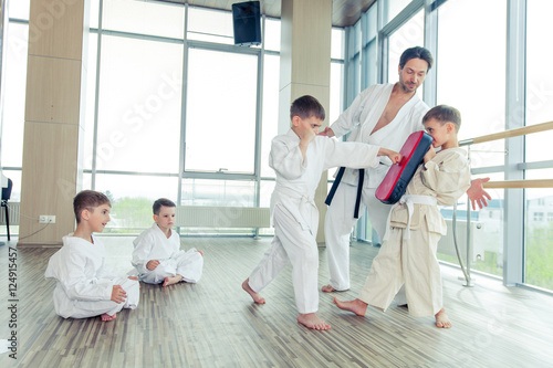 young, beautiful, successful multi ethical kids in karate positi