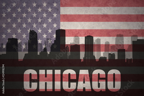 abstract silhouette of the city with text Chicago at the vintage american flag
