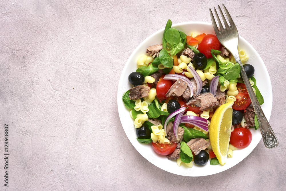 Pasta salad with tuna and vegetables.Top view. Pasta salad with tuna and vegetables.Top view.