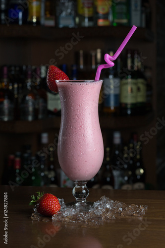 Smoothies with strawberries on the background of a bar