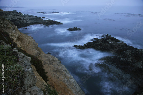 dusk ocean water swirling rocks