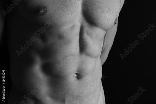 Strong Athletic Man muscular body, torso, hair removal, and six pack abs close up, copy space