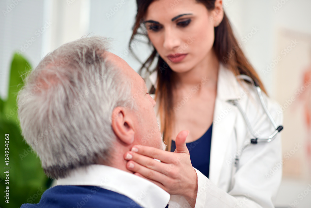 Doctor checking the lymph nodes size Doctor checking the lymph nodes size