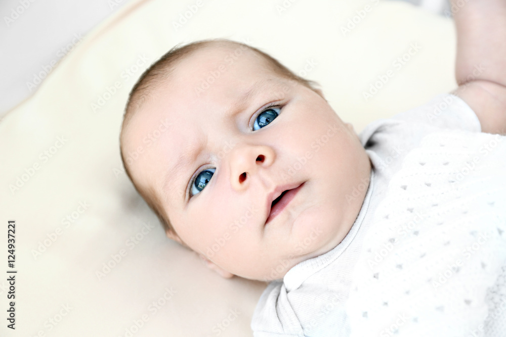 Portrait of cute baby lying on bed Portrait of cute baby lying on bed