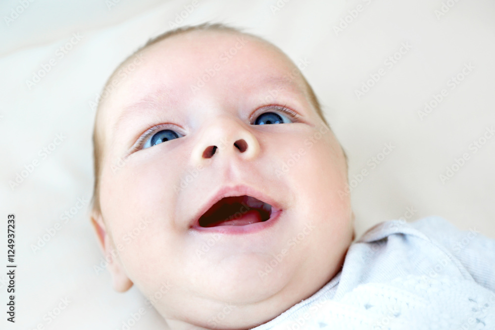 Portrait of cute baby lying on bed, close up view Portrait of cute baby lying on bed, close up view