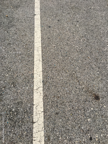 white line on black asphalt road texture background