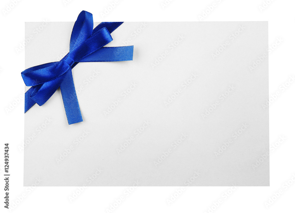 Blue satin ribbon and card on light background Blue satin ribbon and card on light background