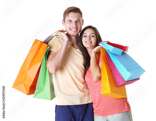 Happy couple with purchases isolated on white