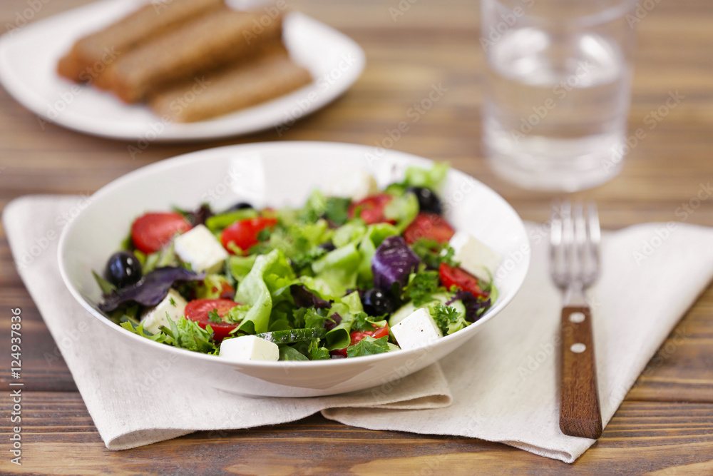 Fresh delicious salad on wooden background, closeup Fresh delicious salad on wooden background, closeup