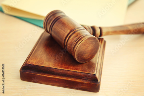 Court gavel and sound block on table, closeup