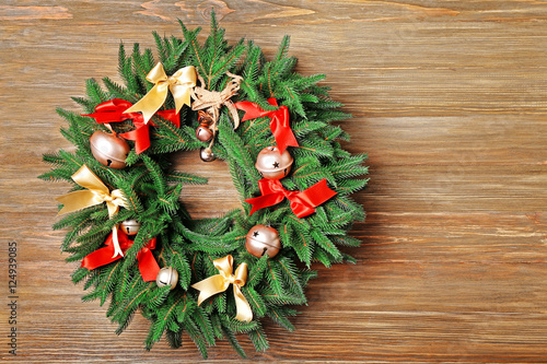 Fototapeta Naklejka Na Ścianę i Meble -  Beautiful Christmas wreath on wooden background