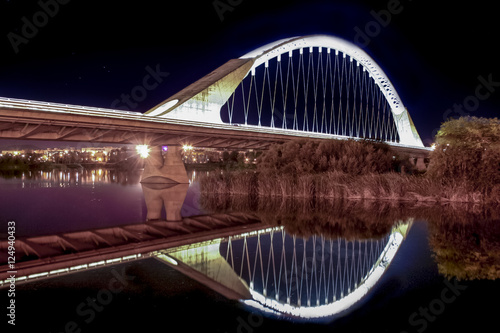 Lusitania bridge over Guadiana River at night photo