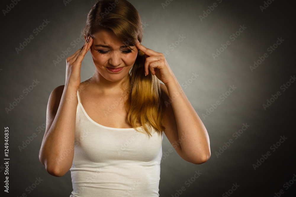 Fototapeta premium Woman suffering from headache migraine pain.