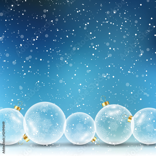 Christmas baubles on snowy background