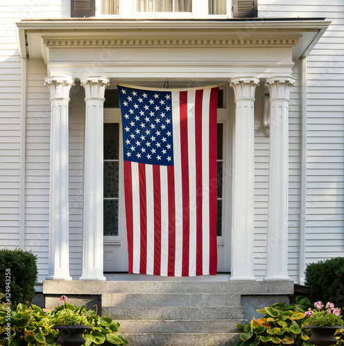 American flag displayed on the door of New England home