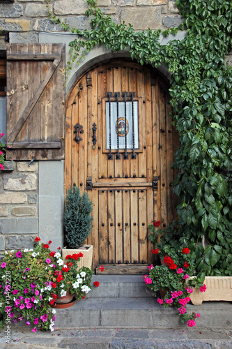 wood arch door n flowers