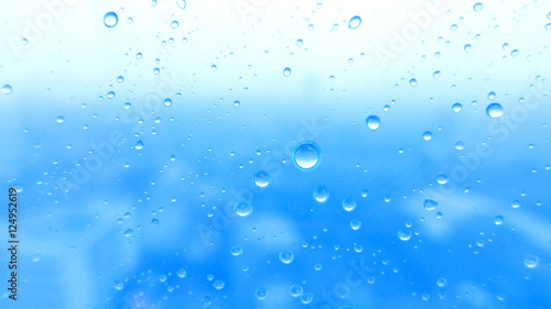 Close-up of water drops on glass surface as background