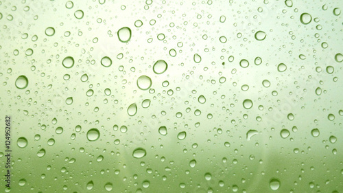 Close-up of water drops on glass surface as background