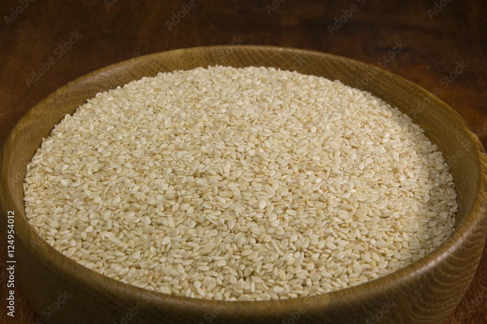 Sesame seeds in a wooden bowl Sesame seeds in a wooden bowl