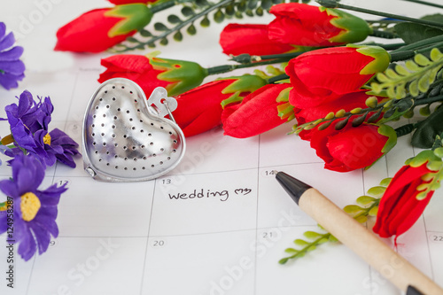 Fototapeta Naklejka Na Ścianę i Meble -  Reminder Wedding day in calendar with pen