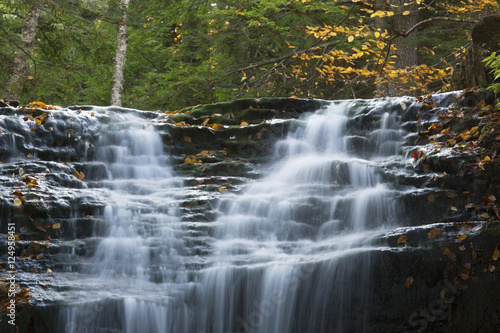 Fototapeta Naklejka Na Ścianę i Meble -  Silky waters of Tama Falls in New Hampshire's White Mountains.