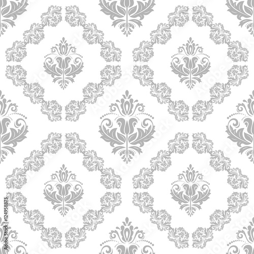 Seamless oriental pattern in the style of baroque. Traditional classic ornament. Light silver pattern