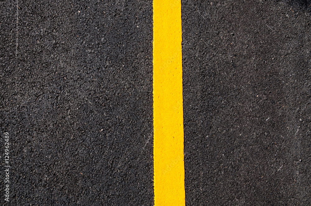 Yellow line on new asphalt detail,Street with yellow line texture